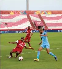  ?? Supplied photo ?? Al Jazira and Dibba players fight for the ball. —