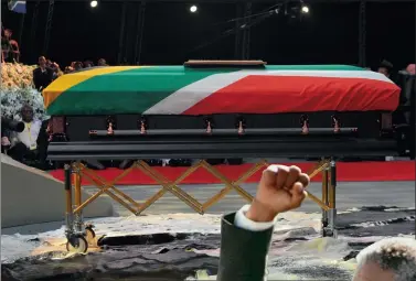  ?? Picture: ELMOND JIYANE, GCIS ?? A flag covers Nelson Mandela’s coffin at his funeral in his childhood village of Qunu.