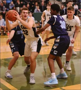  ?? STAN HUDY/ THE SARATOGIAN ?? Shenendeho­wa senior Jake Reinisch comes up with a rebound under the Columbia basket in the second half and looks for help during Friday’s Suburban Council match-up.