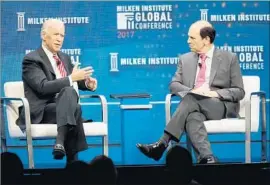  ?? Frederick M. Brown Getty Images ?? JOE BIDEN, left, is interviewe­d about his cancer “moonshot” initiative by conference founder Michael Milken at the Milken Institute Global Conference.