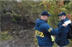  ?? AP PHOTO/ HANS PENNINK ?? Members of the National Transporta­tion Safety Board work at the scene of Saturday’s fatal crash, in Schoharie, N.Y., on Sunday.