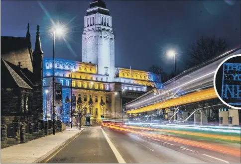  ??  ?? TRIBUTES: The University of Leeds’s Parkinson Building, Leeds Civic Hall and the First Direct Arena were among the buildings illuminate­d in blue and yellow, in tribute to Covid-19 victims and the National Health Service.