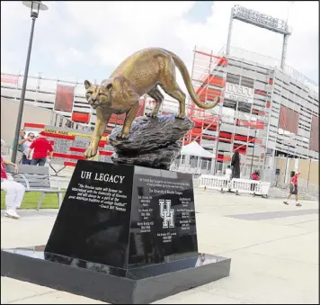  ??  ?? A monument to the Brezina family, which produced six players for the University of Houston, stands outside the Cougars’ stadium. The statue recognizes five Brezina brothers and a nephew who played for the school.