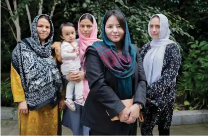  ?? ?? Afghan journalist Zahra Joya with her sisters and niece. Photograph: Linda Nylind/The Guardian