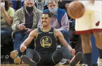  ?? NHAT V. MEYER — BAY AREA NEWS GROUP ?? The Warriors’ Jordan Poole (3) celebrates his basket and foul against the Miami Heat in the fourth quarter in San Francisco on Monday.