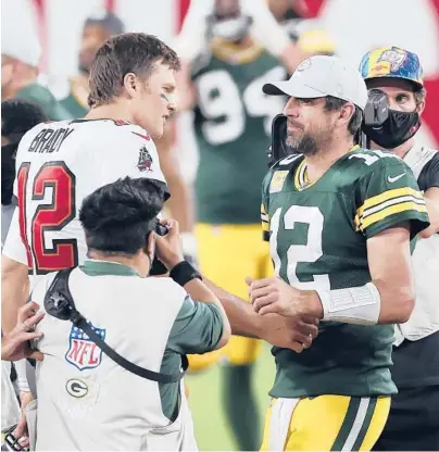  ?? MARK LOMOGLIO/AP ?? Future Hall of Fame QBs Tom Brady, left, and Aaron Rodgers will face off for just the fourth time Sunday.
