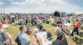  ?? ?? Festival-goers enjoying the fantastic weather. Picture: Mike Cooter (210522)