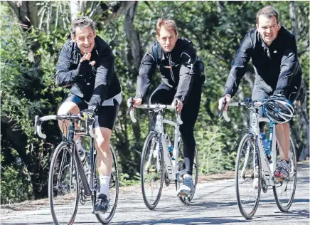  ?? Photo: REUTERS ?? French politician Nicolas Sarkozy with his bodyguards in tow.