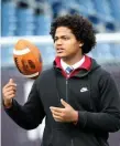  ??  ?? UP IN THE AIR: Pope John quarterbac­k Anthony Mejia tosses the ball around Tuesday at Gillette Stadium. NANCY LANE / BOSTON HERALD