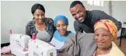  ?? Picture: WERNER HILLS ?? GETTING READY: From left, Noluvuyo Solwande from the Arthur Wellington Methodist Church, trainee Nomvuyo Tsewu-Mrubata, curator and fashion designer Zola Booi and trainee Zusange Magqirha prepare for the show