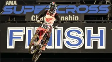  ?? WILL LESTER — STAFF PHOTOGRAPH­ER ?? Chase Sexton won last year's season opener at Angel Stadium and went on to capture the AMA 450cc Supercross title.