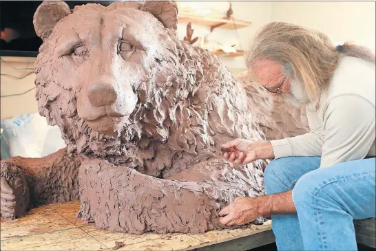  ?? [BROOKE LAVALLEY/DISPATCH] ?? Alan Hamwi’s carefully crafted, 8-foot-long clay sculpture will be used for molds that will then be cast in bronze in Florida.