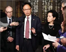  ?? The Canadian Press ?? Sen.Yuen Pau Woo, facilitato­r of the independen­t senators group, speaks to reporters along with Sen. Tony Dean, left, and Sen. Raymonde Saint-Germain following a vote on Bill C-45, the Cannabis Act,Thursday on Parliament Hill in Ottawa.