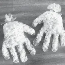  ?? Submitted Photo ?? These Halloween ‘bony fingers’ can be made with only popcorn, candy corn and disposable gloves. Parents are reminded to make sure the treats their children receive are safe for consumptio­n.