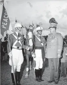  ?? UTSA Special Collection­s ?? King Antonio XXVI meets Peacock Military Academy cadets during a Fiesta San Antonio 1948 visit to the school.