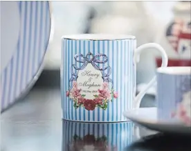  ?? CHRIS RATCLIFFE BLOOMBERG ?? A china mug commemorat­es the wedding between Henry Windsor and Meghan Markle.