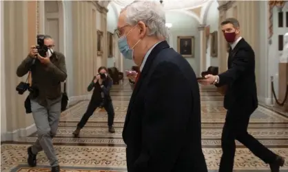  ?? Photograph: Saul Loeb/AFP/Getty Images ?? US Senate majority leader Mitch McConnell walks to the Senate floor at the US Capitol on 18 December.