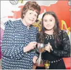  ?? (Pic: John Tarrant) ?? Katie Looney, Burnfort, winner at Solo Dance in the Co. Scór na bPaistí final receives her prize from Margaret Whelan, secretary, Cork Scór.