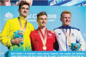  ??  ?? GOLD COAST: L-R: Australia’s James Connor, England’s Jack Laugher and Scotland’s James Heatly pose with their medals after the men’s 1m springboar­d diving final during the 2018 Gold Coast Commonweal­th Games at the Optus Aquatic Centre in the Gold Coast...