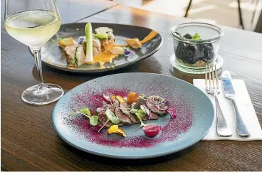  ??  ?? Universo Brasserie & Bar offers a welcoming environmen­t with delicious, upscale dishes such as the pictured chicken ballotine, smoked portobello mushrooms and tender venison.