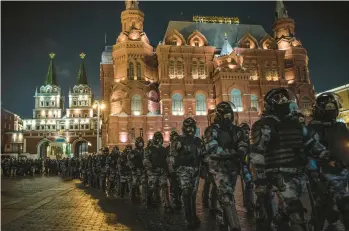  ?? SERGEY PONOMAREV/THE NEW YORK TIMES ?? Police in riot gear march through Moscow’s Red Square on Feb. 2. Just over three weeks later, Russia would invade Ukraine. For opposition figures who chose to stay, imprisonme­nt was simply a matter of when.