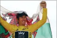  ?? CHRISTOPHE ENA — THE ASSOCIATED PRESS ?? Tour de France winner Britain’s Geraint Thomas, wearing the overall leader’s yellow jersey, celebrates with the flag of Wales on the podium after the twenty-first stage of the Tour de France cycling race over 116 kilometers (72.1 miles) with start in...