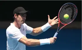  ??  ?? Andy Murray puts in some practice with Grigor Dimitrov yesterday