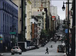  ?? ERIC RISBERG — THE ASSOCIATED PRESS FILE ?? On Feb. 15, 2011, a view looking up Taylor Street of the Tenderloin neighborho­od in San Francisco is seen.