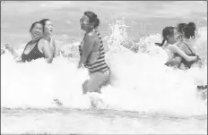  ?? ASSOCIATED PRESS ?? DAYTONA BEACH, FLA., IS CROWDED with beachgoers on Saturday. Isaias is expected to return to hurricane strength as it nears Florida.