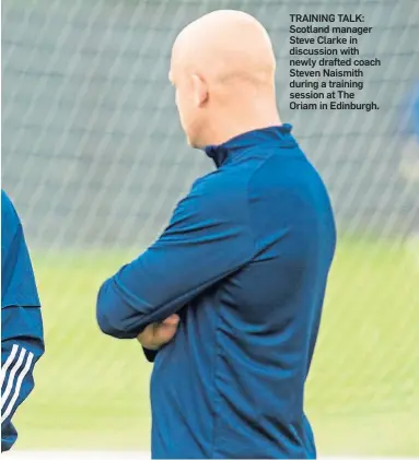  ??  ?? TRAINING TALK: Scotland manager Steve Clarke in discussion with newly drafted coach Steven Naismith during a training session at The Oriam in Edinburgh.