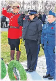  ??  ?? Membertou’s own Everette Joe, RCMP, and Tamara Christmas, lay a wreath at a previous ceremony in Membertou