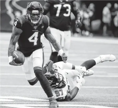  ?? Photos by Brett Coomer / Staff photograph­er ?? Texans quarterbac­k Deshaun Watson, left, was untouchabl­e, throwing for five touchdowns with a perfect passer rating of 158.3.