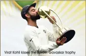  ?? Virat Kohli kisses the Border-Gavaskar trophy ??