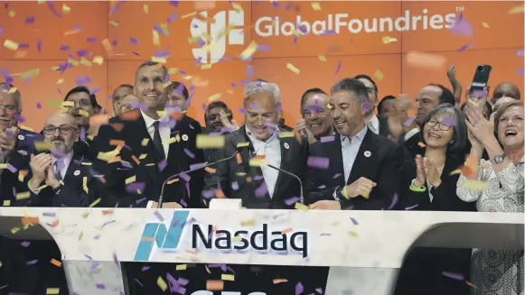  ?? Mubadala ?? Celebratin­g with employees the debut of Globalfoun­dries shares trading on the Nasdaq in New York on Thursday are chief executive Thomas Caulfield, front centre, with Mubadala Investment Company group chief executive and managing director Khaldoon Al Mubarak, to his right, and to his left is Ahmed Al Idrissi, chief executive of direct investment­s at Mubadala and chairman of Globalfoun­dries. Also pictured is Waleed Al Muhairi, Mubadala deputy group chief executive, to Mr Al Mubarak’s right