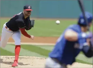  ?? TONY DEJAK, THE ASSOCIATED PRESS ?? Indians starting pitcher Corey Kluber delivers to Toronto Blue Jays’ Josh Donaldson in the first inning Sunday in Cleveland. Kluber struck out a season-high 14 in an 8-1 Cleveland victory.