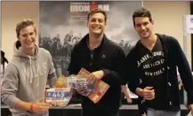  ??  ?? Iron Man competitor­s Andrew Revell, 24, left, and Nicholas Simmons, 22, right, from Cape Town are challengin­g their Durban mate, Darren Nunes, 25, centre, to a loser-shaves-his-head bet in the endurance event taking place on the Durban beachfront...