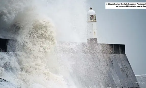  ?? Richard Swingler ?? &gt; Waves batter the lighthouse at Porthcawl as Storm Ali hits Wales yesterday