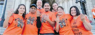  ?? JOHN HORGAN, VIA TWITTER ?? Premier John Horgan, third from left, posted this on his Twitter account Thursday with the following message: #OrangeShir­tDay reminds us not to turn away from the difficult stories about residentia­l schools. #EveryChild­Matters.