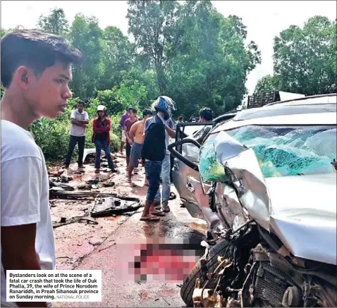  ?? NATIONAL POLICE ?? Bystanders look on at the scene of a fatal car crash that took the life of Ouk Phalla, 39, the wife of Prince Norodom Ranariddh, in Preah Sihanouk province on Sunday morning.