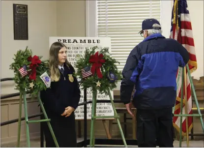  ?? PHOTOS BY JACLYN LUNA ?? Willits FFA member Catie Spackman and United States Navy Veteran Bob Green lay the memorial wreaths during the modified Willits Wreaths Across America ceremony.