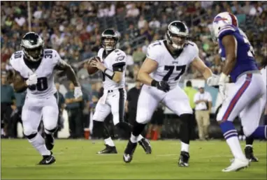  ?? MATT ROURKE — THE ASSOCIATED PRESS ?? Lane Johsnon blocks as Eagles quarterbac­k Matt McGloin drops back to pass Thursday.