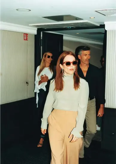 ??  ?? Top and trousers, Chloé; sunglasses, Céline; earrings, featuring four kunzites (a total of 96ct), diamonds, beryl and tanzanites, from the Haute Joaillerie collection, Chopard (020-7287 8710). Photograph­s: Jonas Unger at Bird Production. Styling:...