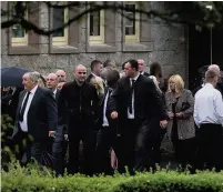  ??  ?? RESPECTS Mourners outside the service