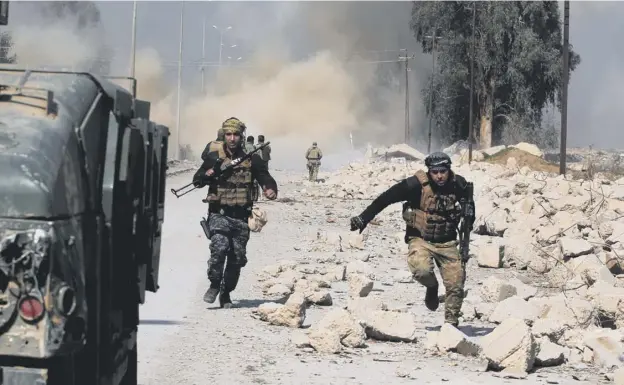  ?? PICTURE: GETTY IMAGES ?? 0 Smoke and dust rise as Iraqi forces attack Mosul airport during an offensive to retake the western side of the city from Islamic State militants