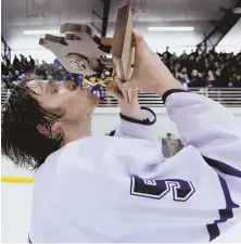  ?? HERALD pHoto by JoSEpH pREZIoSo ?? SWEET TASTE: Tommy Marhoffer kisses the Division 2 South championsh­ip trophy after top-seeded Scituate blanked Medway, 4-0, yesterday in Bourne.