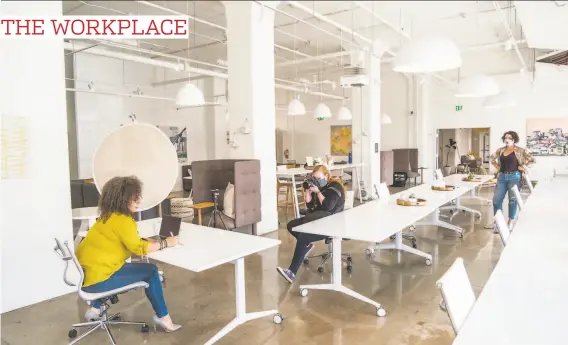  ?? Nick Otto / Special to The Chronicle ?? Hivery founder Grace Kraaijvang­er ( far right) watches as Kristen Loken photograph­s Amber AllenPeaso­n at the Fort Mason coworking space. Kraaijvang­er launched a virtual coworking program during the pandemic and has been renting out the oncebustli­ng physical space for photo shoots and to small groups.