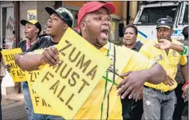  ?? Marco Longari AFP/Getty Images ?? SUPPORTERS of South African Deputy President Cyril Ramaphosa chant slogans at an anti-Jacob Zuma rally outside ANC headquarte­rs in Johannesbu­rg.