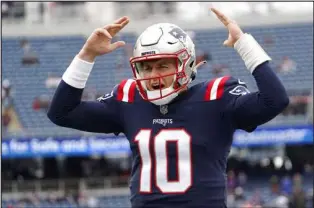  ?? Mary Schwalm The Associated Press ?? New England Patriots quarterbac­k Mac Jones has a 70.3 percent completion rate this season while throwing for 16 touchowns.