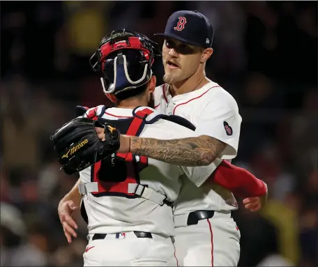  ?? MATT STONE — BOSTON HERALD ?? Red Sox pitcher Tanner Houck, right, gets a hug from catcher Connor Wong after throwing a complete game in a 2-0 win over the Cleveland Guardians at Fenway Park.