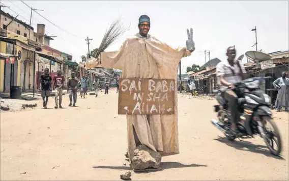  ??  ?? Slippery: A dummy of Muhammadu Buhari before the presidenti­al elections. He has made hard decisions in tough times.